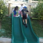 children enjoying slide