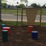 painted wood stools on mulch