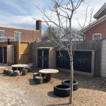 wooden round tables with cut log seats