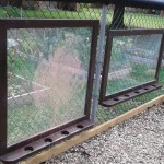 window panes on chain link fence as playground divider