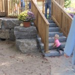 child on rock stairs